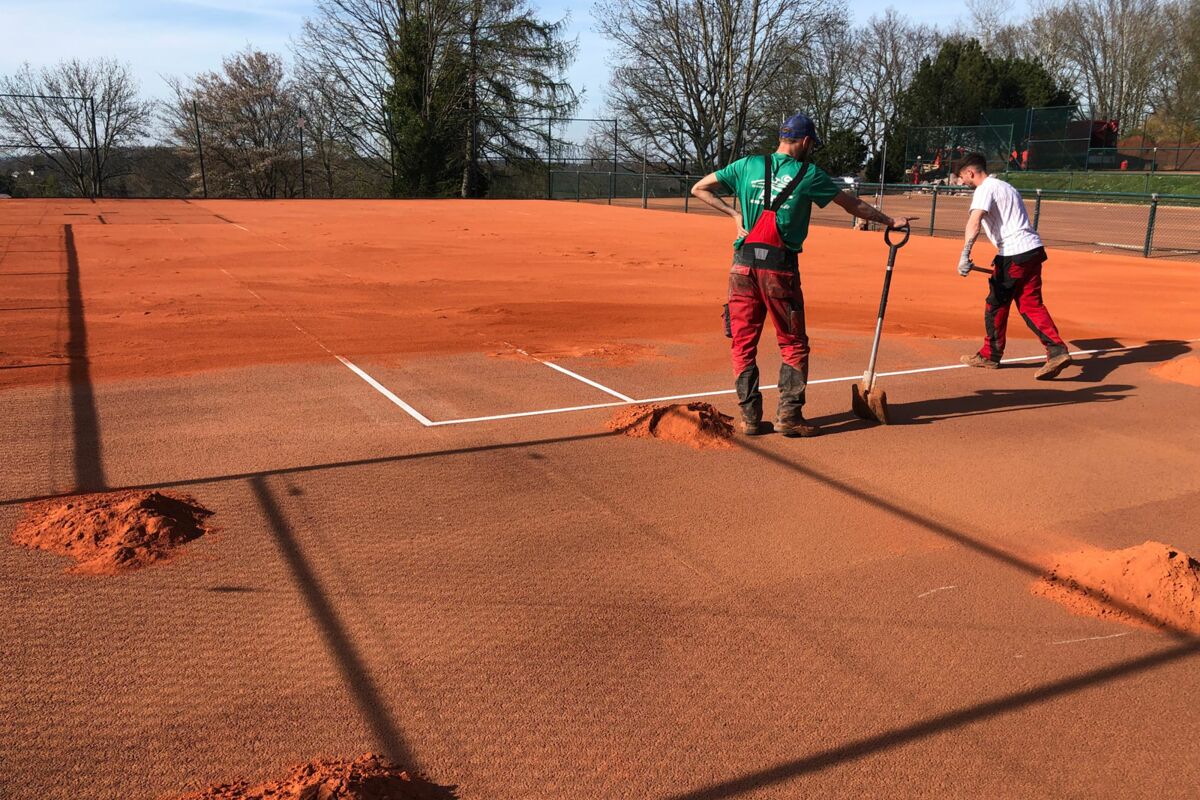The clay is distributed on the court